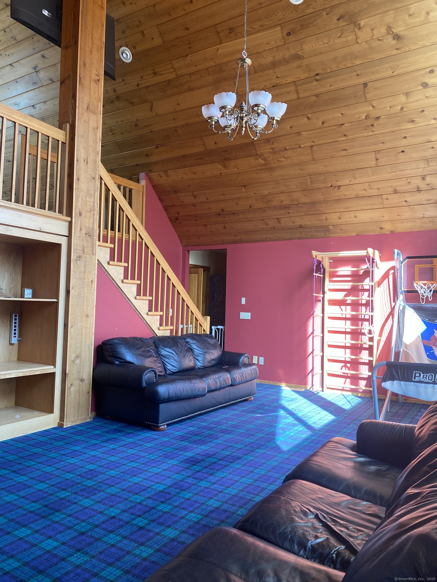 21 Holiday Point Road Sherman, CT 06784 - Photo 10 of 25 a living room with furniture and a chandelier