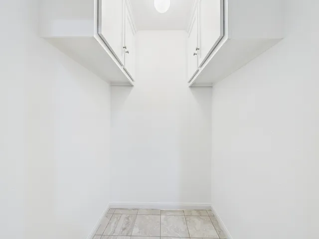 a view of a door and wooden floor