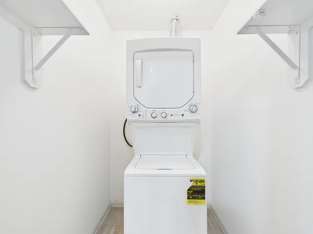 a view of a porch with wooden floor and furniture