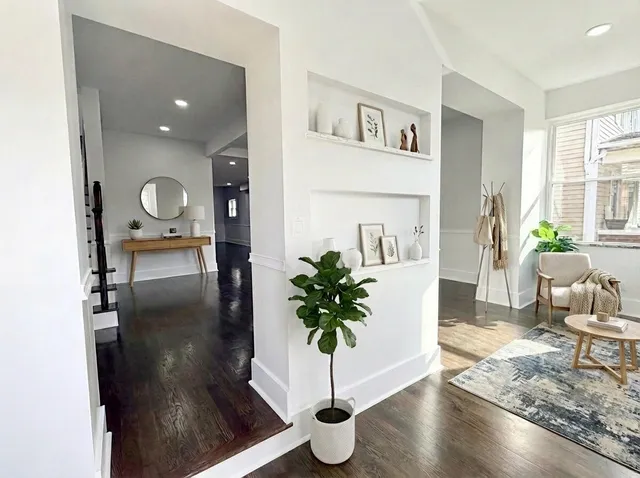 a bathroom with a granite countertop sink a toilet and a mirror