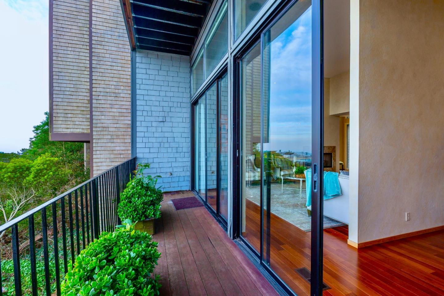 13 Ora Way San Francisco, CA 94131 - Photo 13 of 60 a view of a porch with a floor to ceiling window and wooden fence