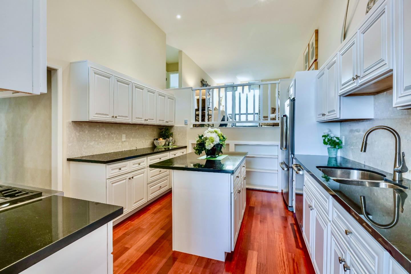 13 Ora Way San Francisco, CA 94131 - Photo 17 of 60 a kitchen with stainless steel appliances a sink a stove top oven a counter space and cabinets