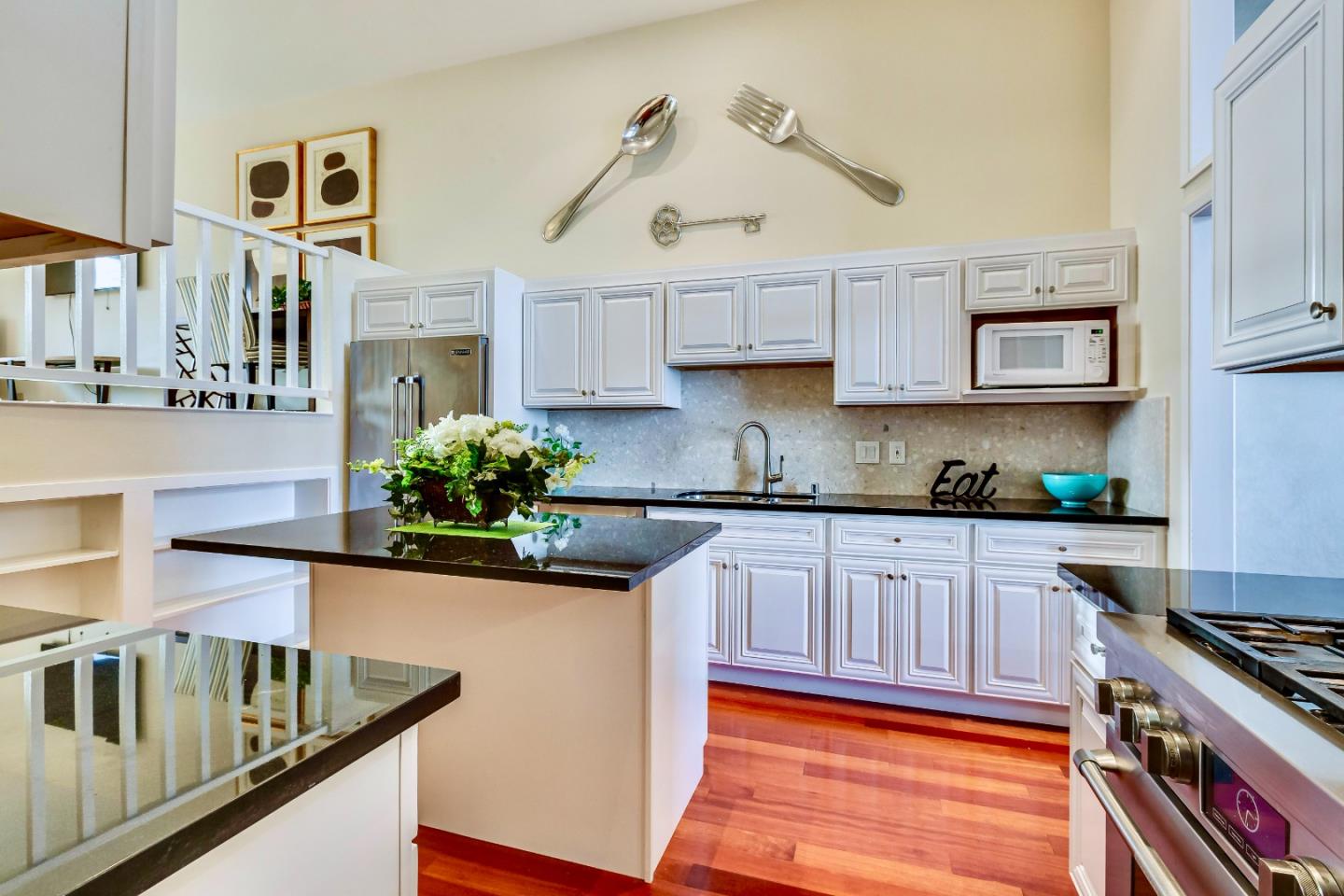 13 Ora Way San Francisco, CA 94131 - Photo 21 of 60 a kitchen with stainless steel appliances granite countertop a stove a sink and a granite counter tops with white cabinets