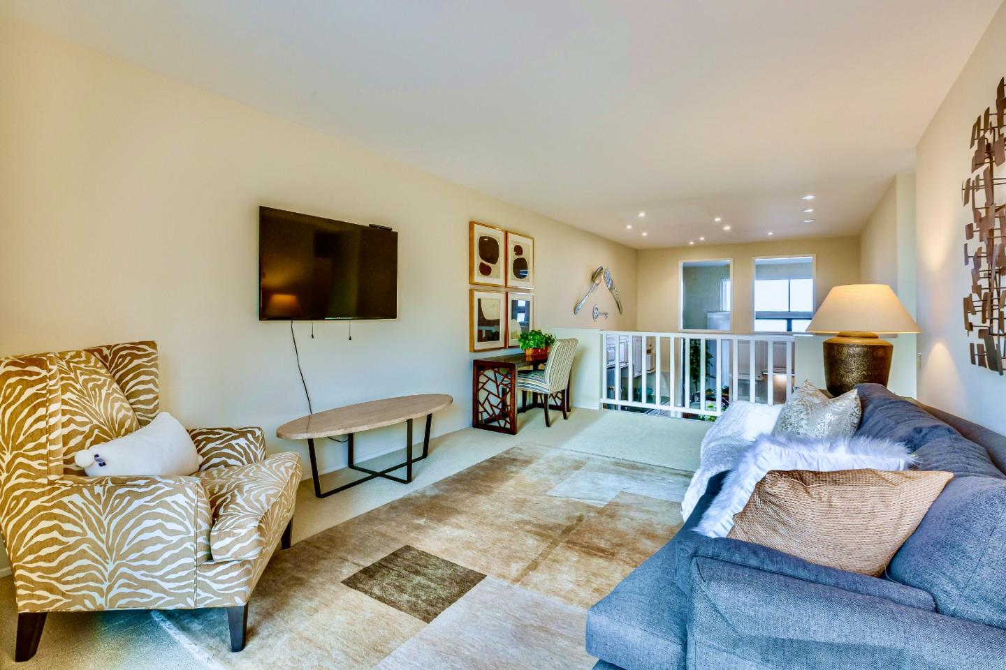 13 Ora Way San Francisco, CA 94131 - Photo 25 of 60 a living room with furniture and a flat screen tv