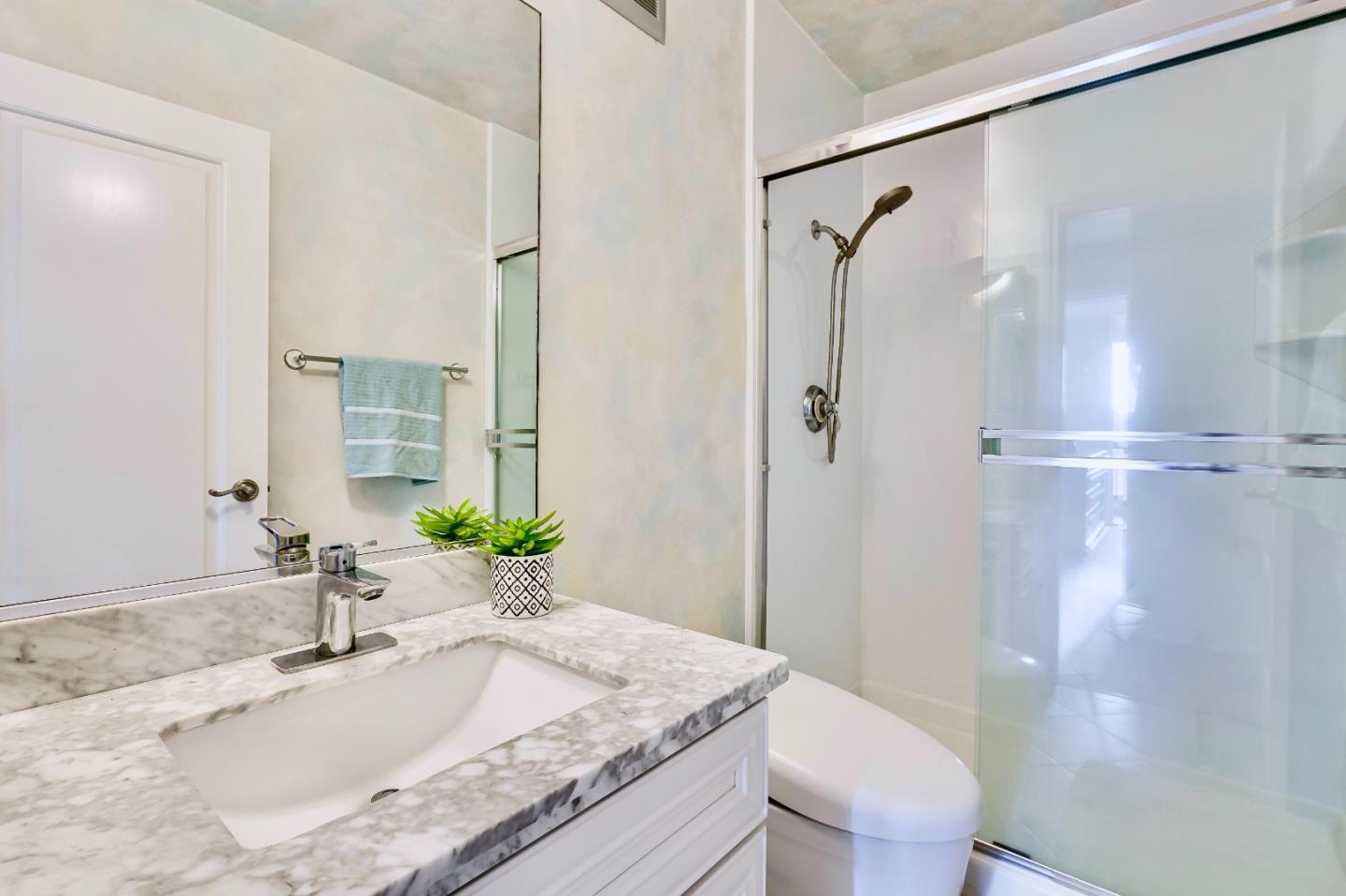 13 Ora Way San Francisco, CA 94131 - Photo 28 of 60 a bathroom with a granite countertop sink toilet and shower