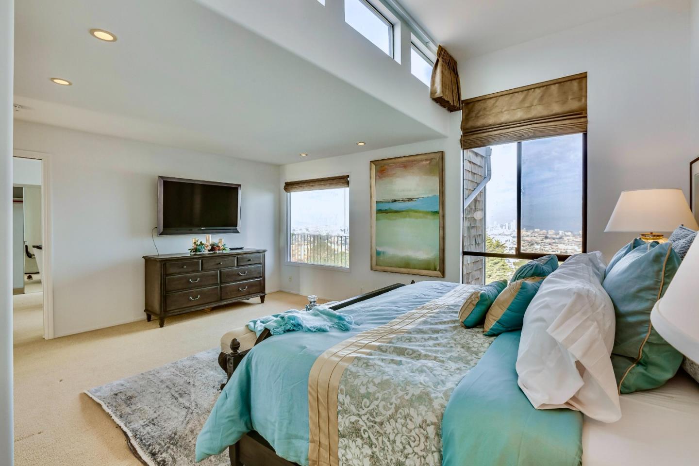 13 Ora Way San Francisco, CA 94131 - Photo 32 of 60 a spacious bedroom with a bed and glass windows