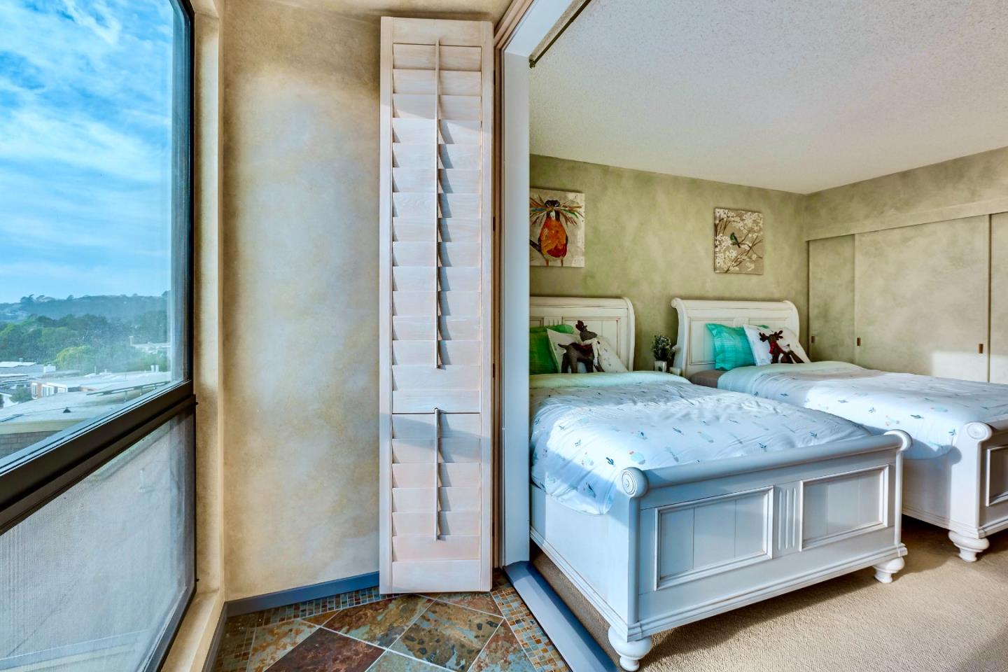 13 Ora Way San Francisco, CA 94131 - Photo 44 of 60 a spacious bedroom with a bed and a dresser