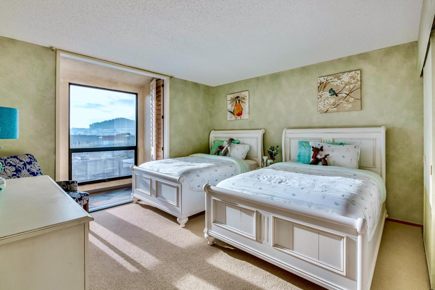 13 Ora Way San Francisco, CA 94131 - Photo 45 of 60 a bedroom with a bed and a painting on the wall