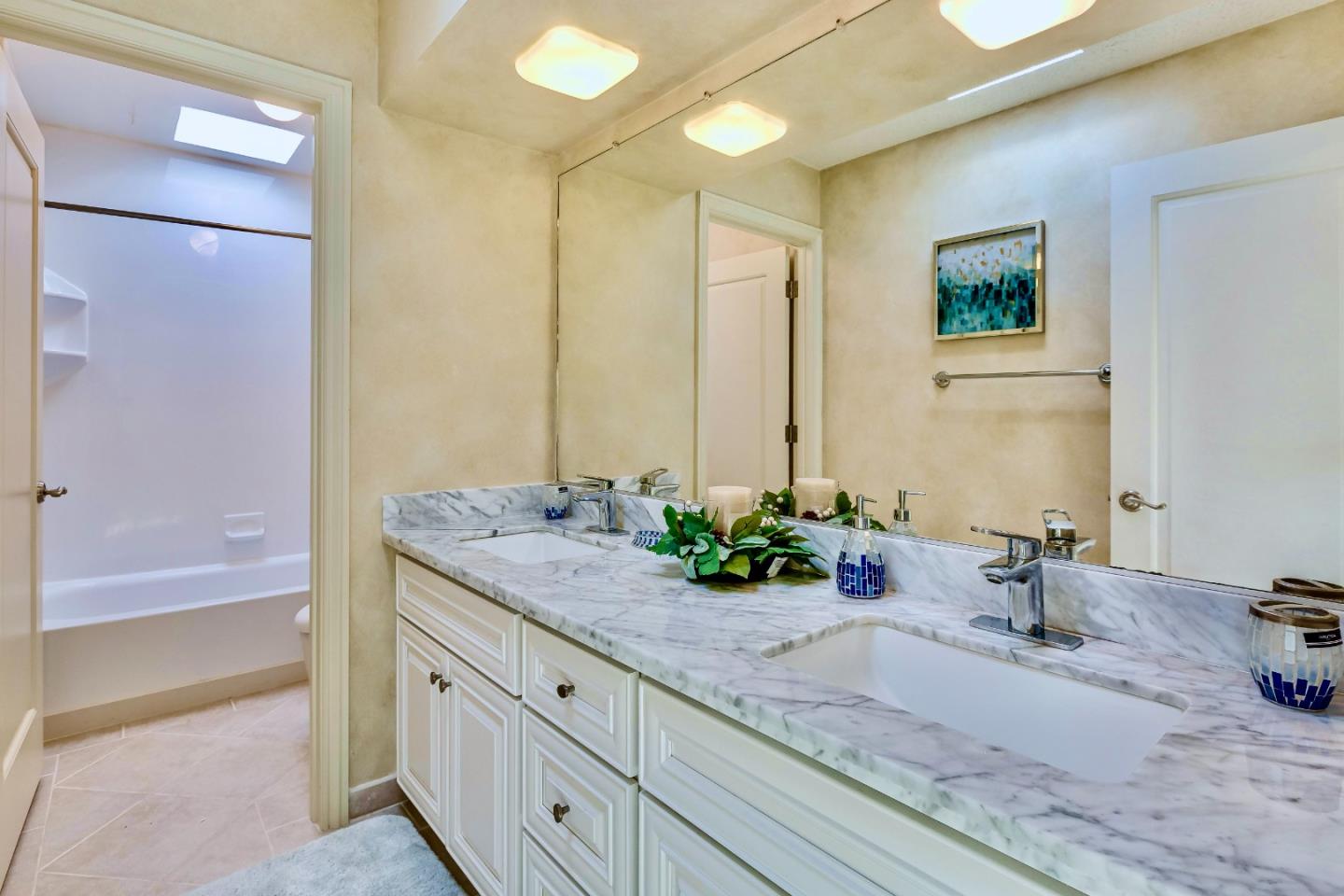 13 Ora Way San Francisco, CA 94131 - Photo 47 of 60 a bathroom with a granite countertop sink a mirror and a bathtub