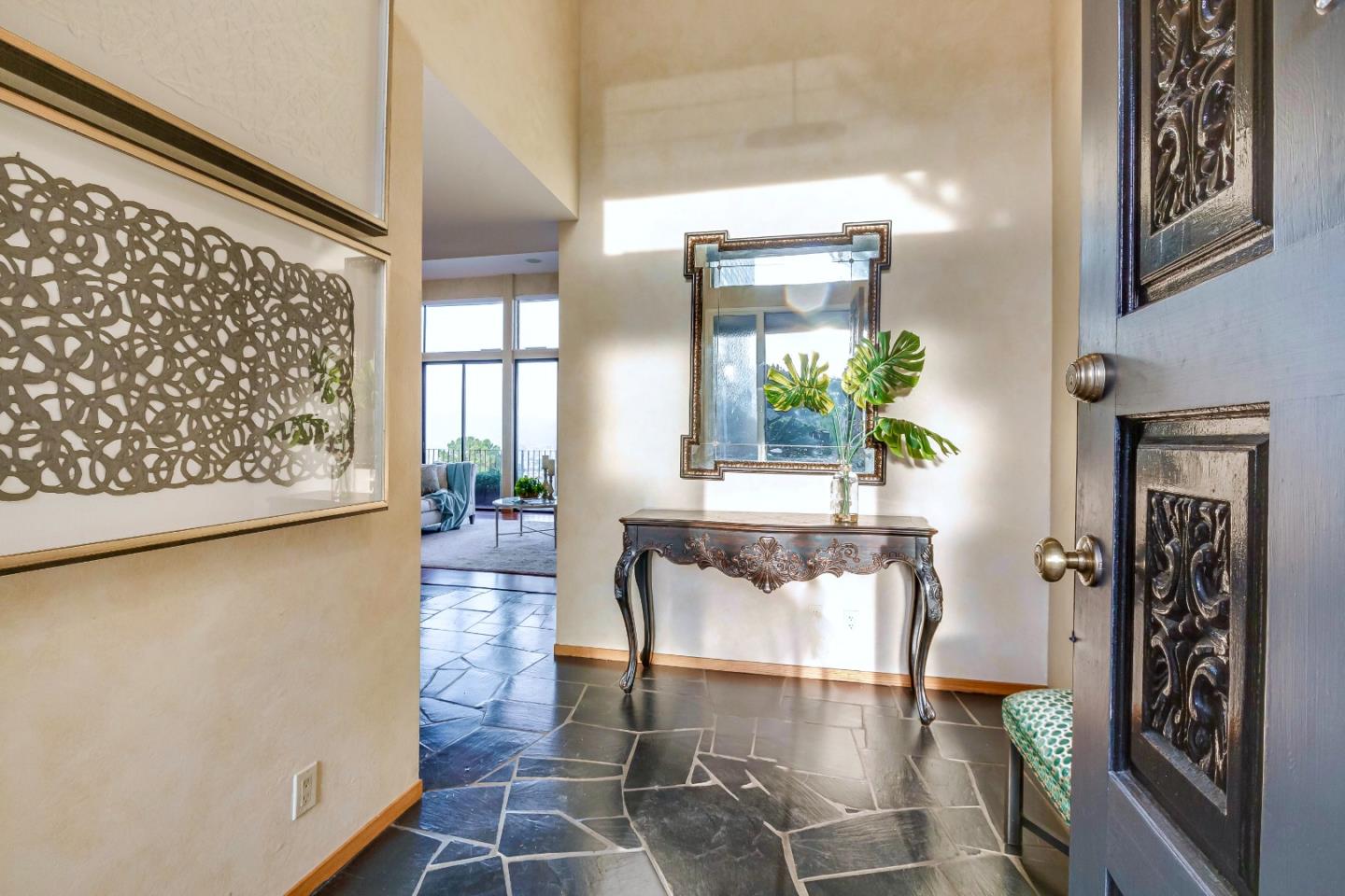13 Ora Way San Francisco, CA 94131 - Photo 5 of 60 a hallway with a dining table and a large window