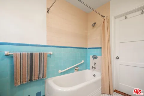 a bedroom with a bed and furniture