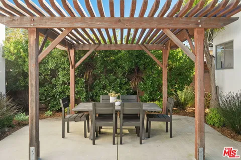 a view of a house with a small yard