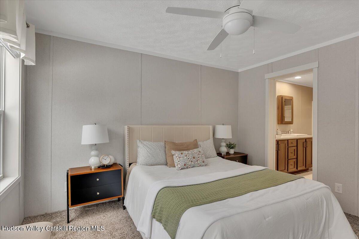 185 Old State Road Broadalbin, NY 12025 - Photo 15 of 31 a bedroom with a bed and a night stand