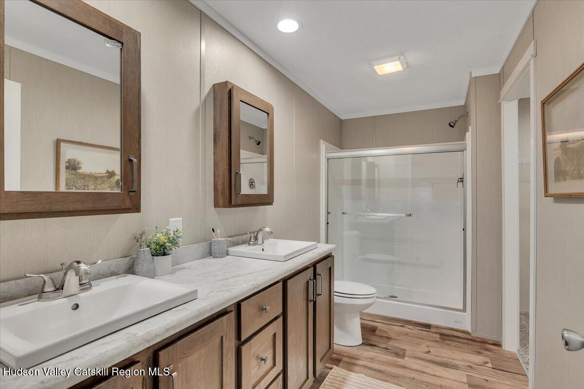 185 Old State Road Broadalbin, NY 12025 - Photo 16 of 31 a bathroom with a granite countertop sink a toilet and shower