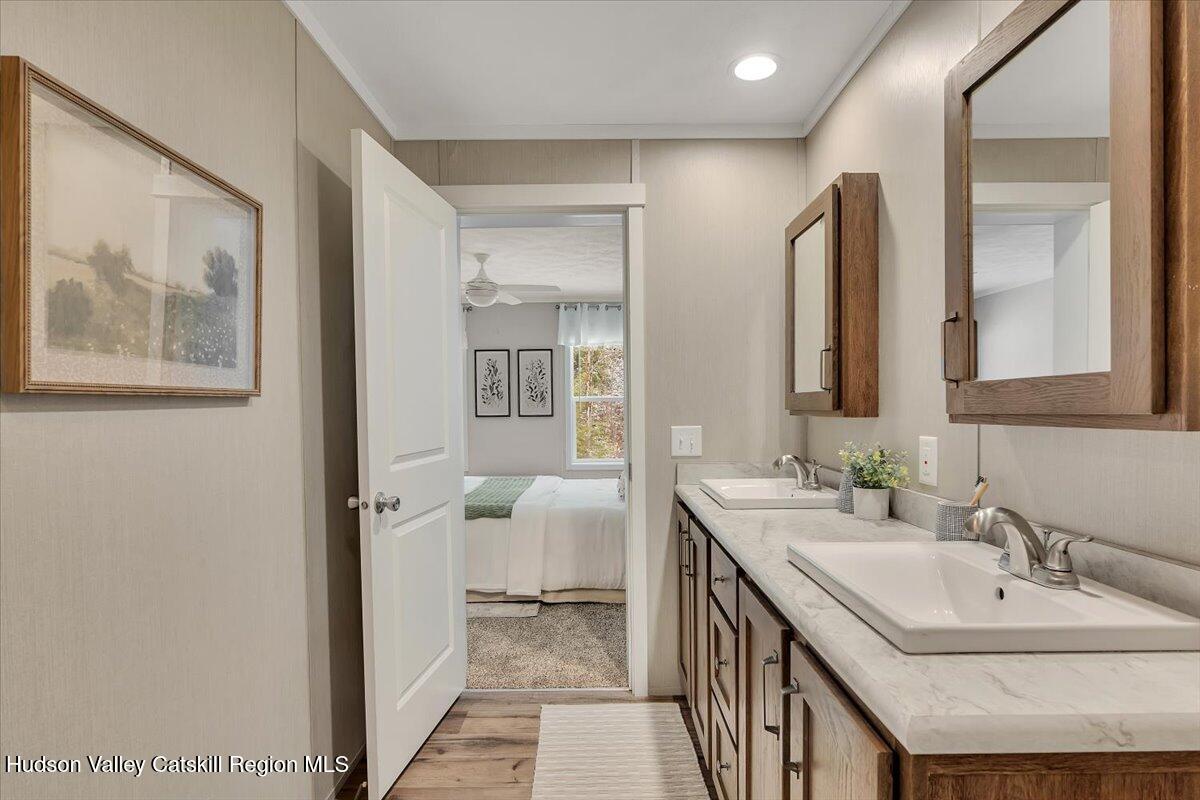 185 Old State Road Broadalbin, NY 12025 - Photo 17 of 31 a en suite bathroom with a double vanity sink and a mirror