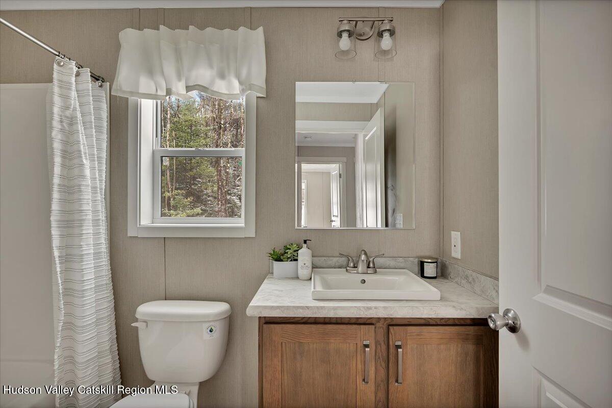 185 Old State Road Broadalbin, NY 12025 - Photo 22 of 31 a bathroom with a granite countertop sink toilet and shower