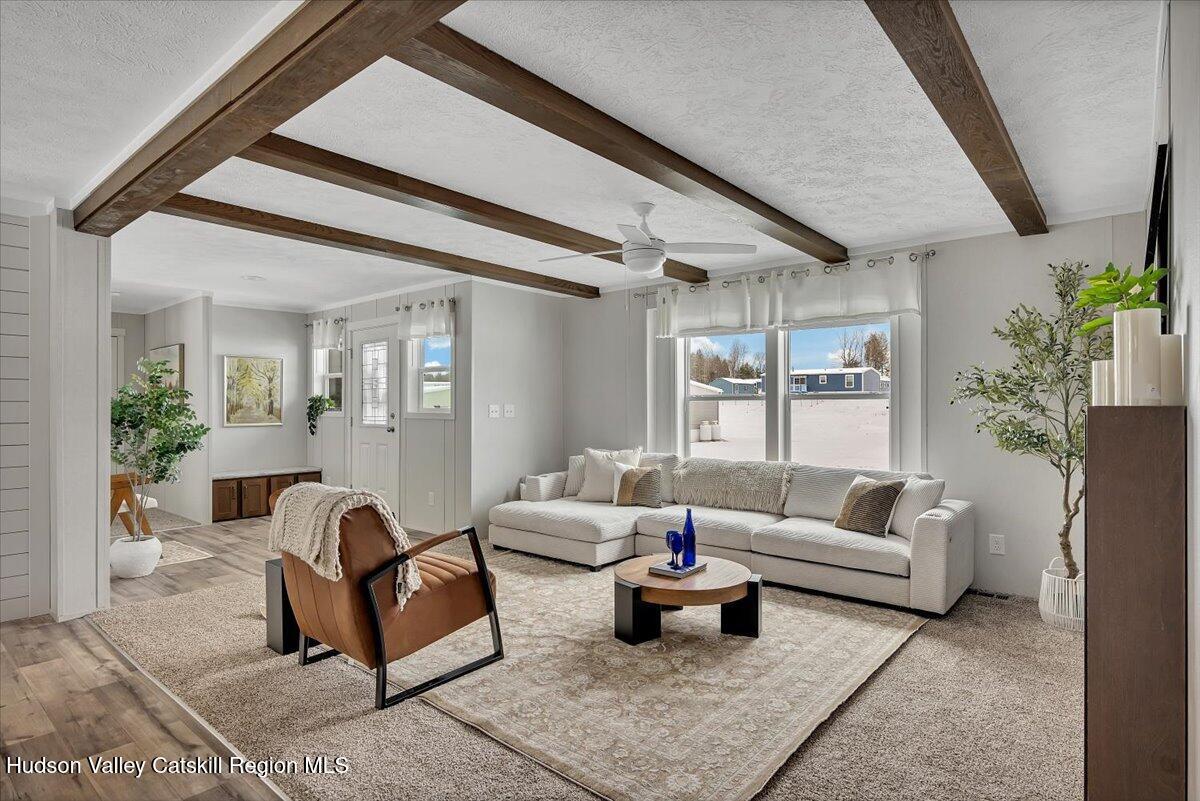 185 Old State Road Broadalbin, NY 12025 - Photo 7 of 31 a living room with furniture and a potted plant