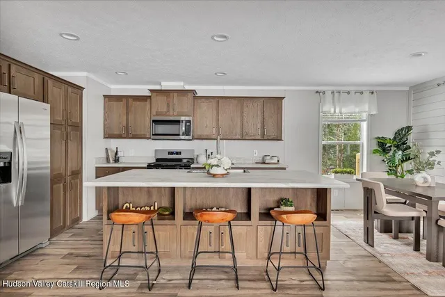 a large kitchen with a table and chairs in it