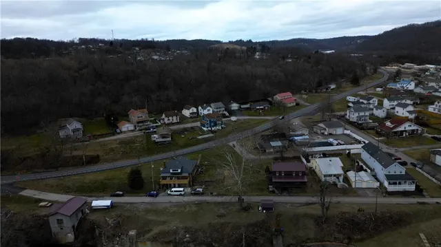 a view of a town with mountains in the background