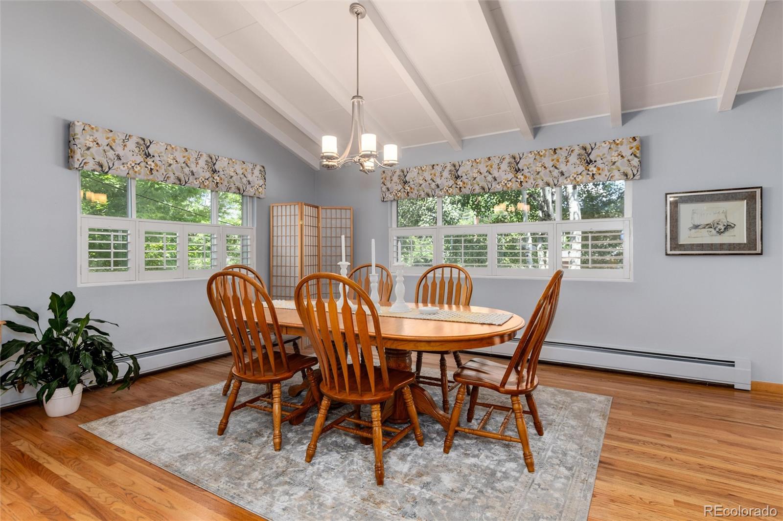 3375 Nelson Street Wheat Ridge, CO 80033 - Photo 14 of 35 a view of a dining room with furniture window and wooden floor