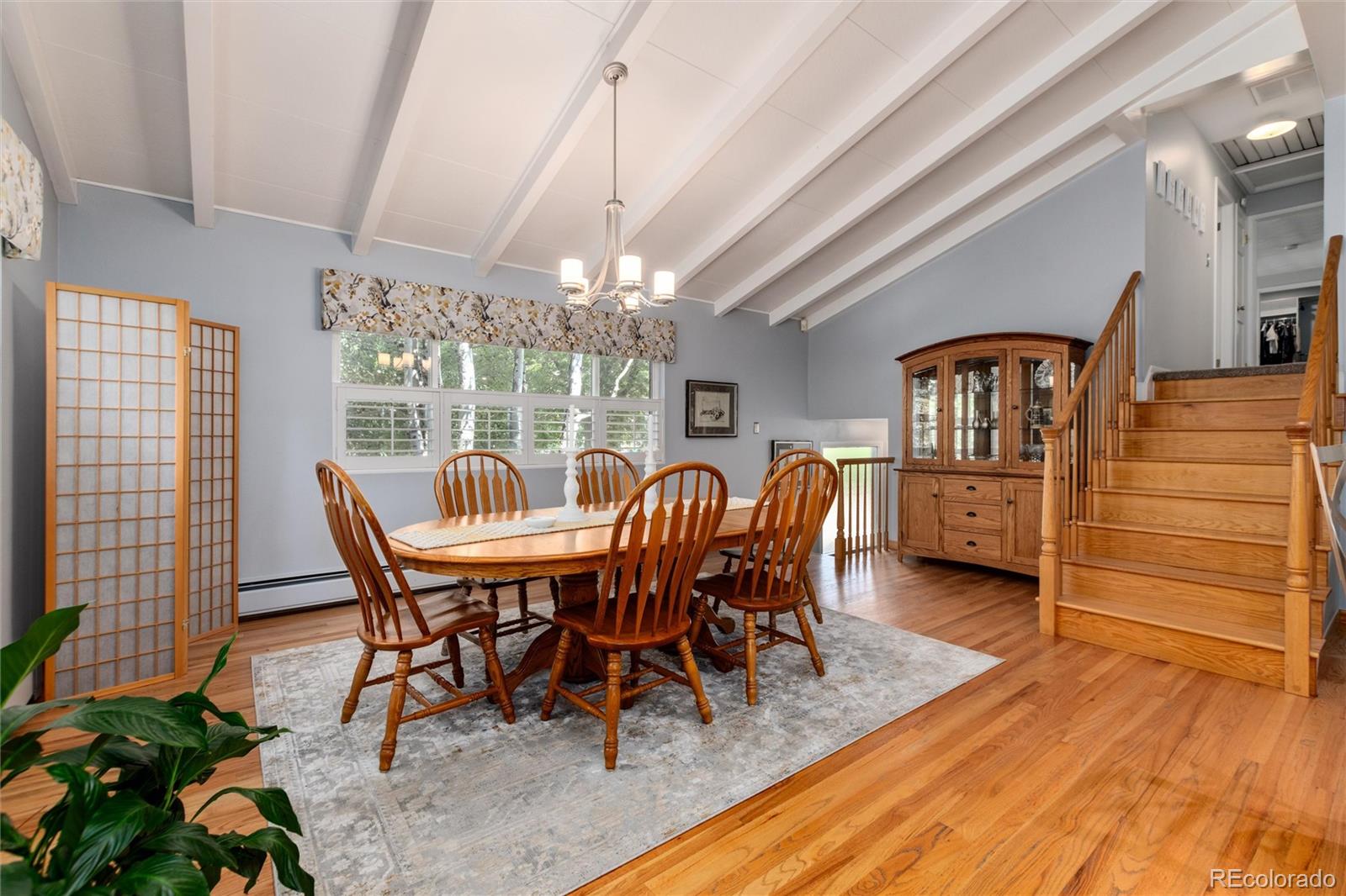 3375 Nelson Street Wheat Ridge, CO 80033 - Photo 15 of 35 a view of a dining room with furniture window and wooden floor