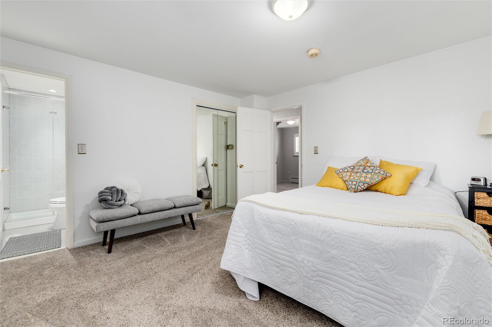 3375 Nelson Street Wheat Ridge, CO 80033 - Photo 21 of 35 a bedroom with a bed a couch and a window