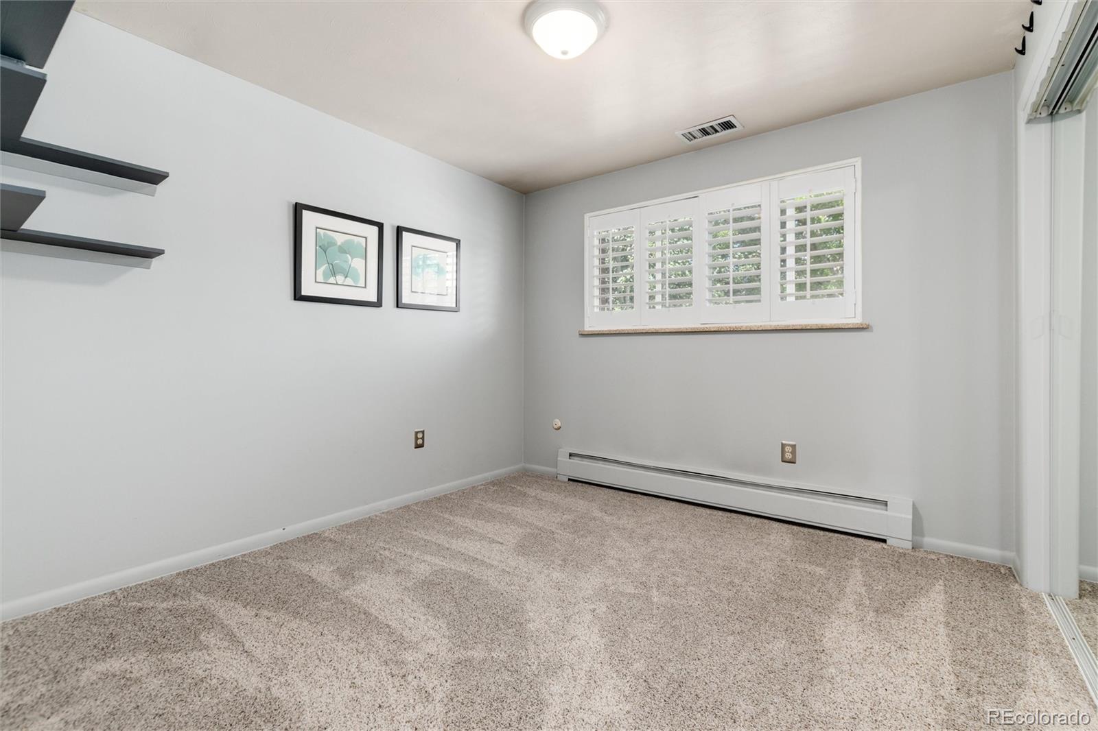 3375 Nelson Street Wheat Ridge, CO 80033 - Photo 23 of 35 a view of an empty room with a window