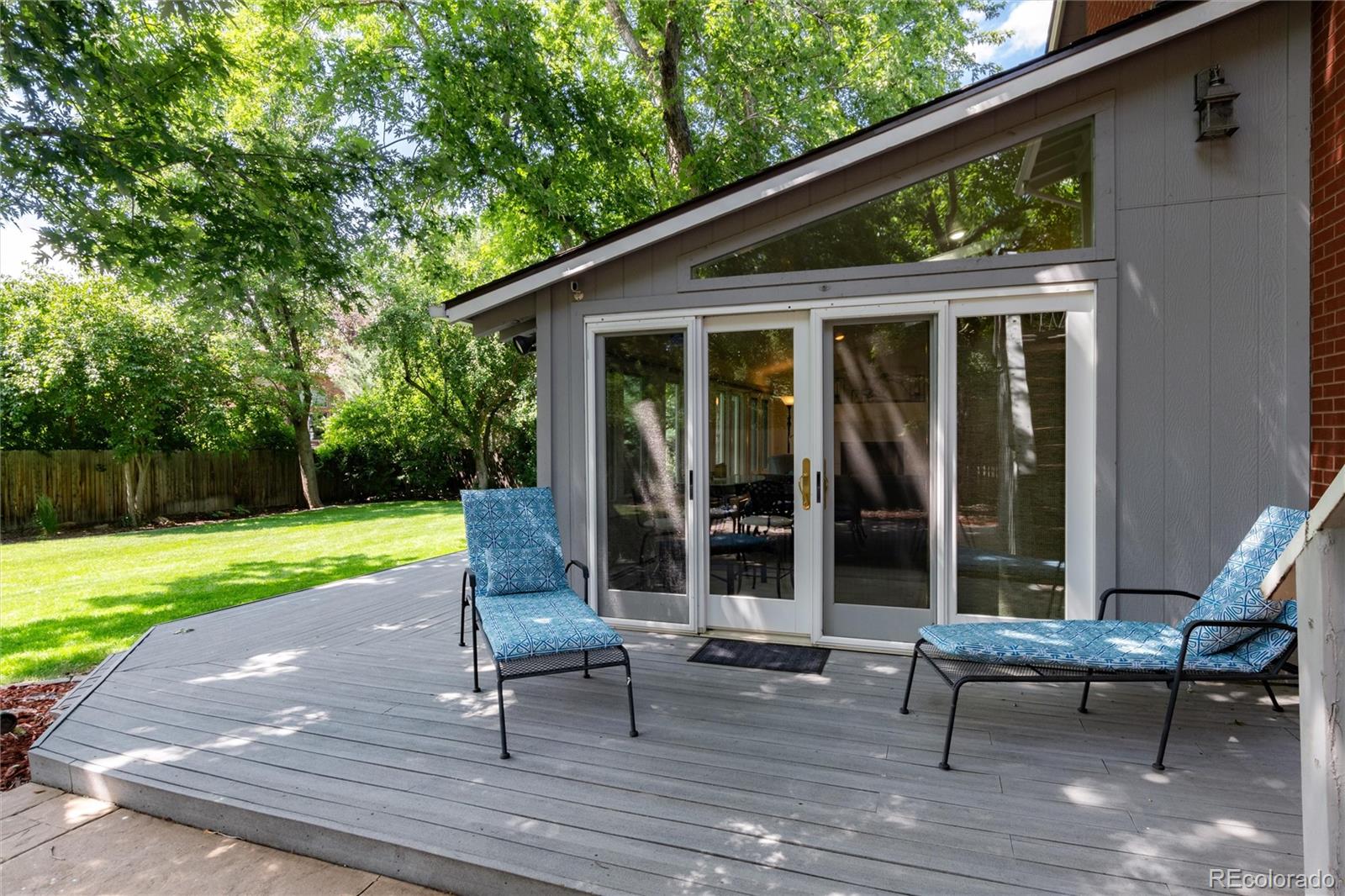 3375 Nelson Street Wheat Ridge, CO 80033 - Photo 25 of 35 a view of a patio with a table chairs and a yard