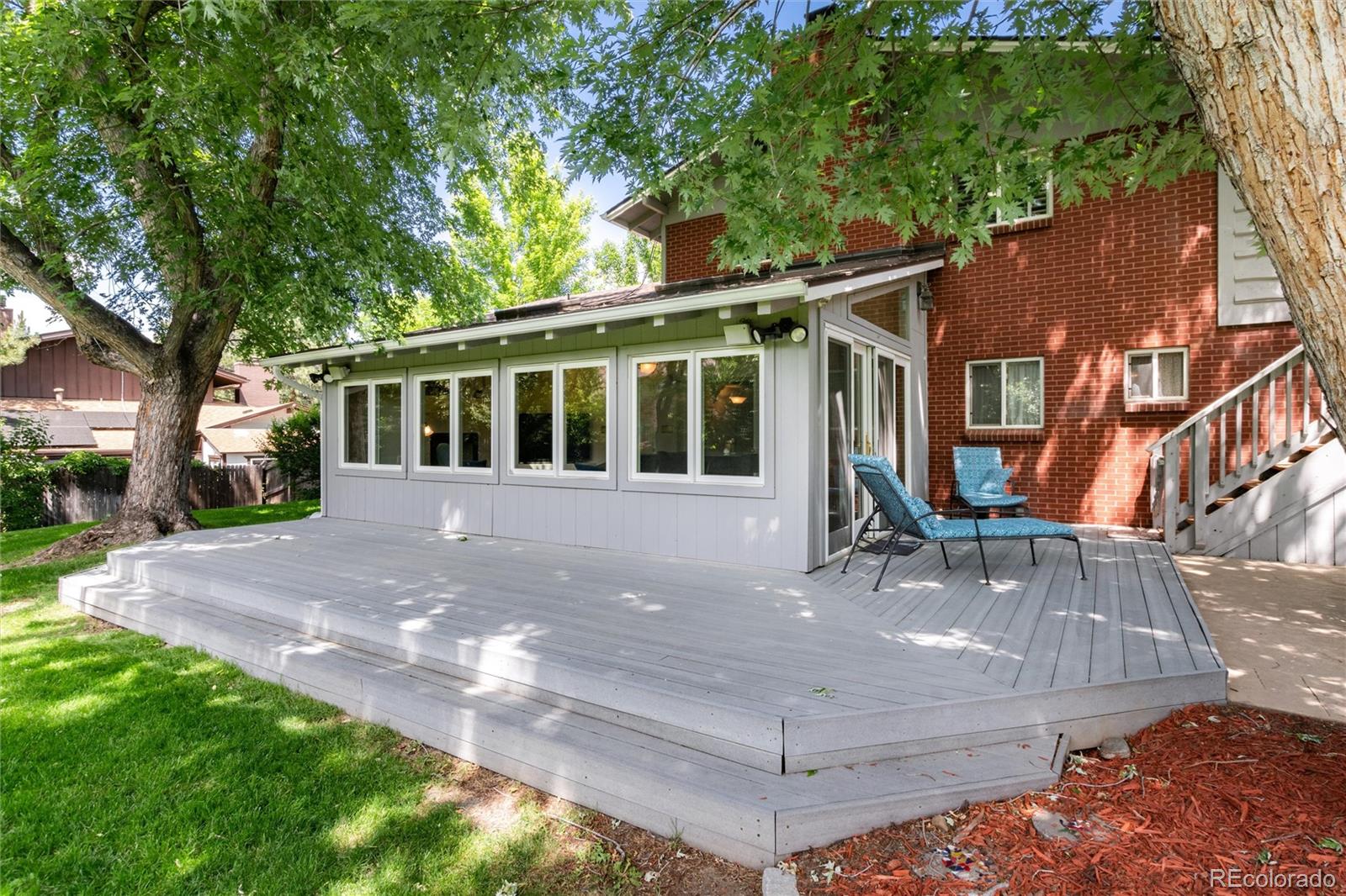 3375 Nelson Street Wheat Ridge, CO 80033 - Photo 28 of 35 a front view of a house with garden