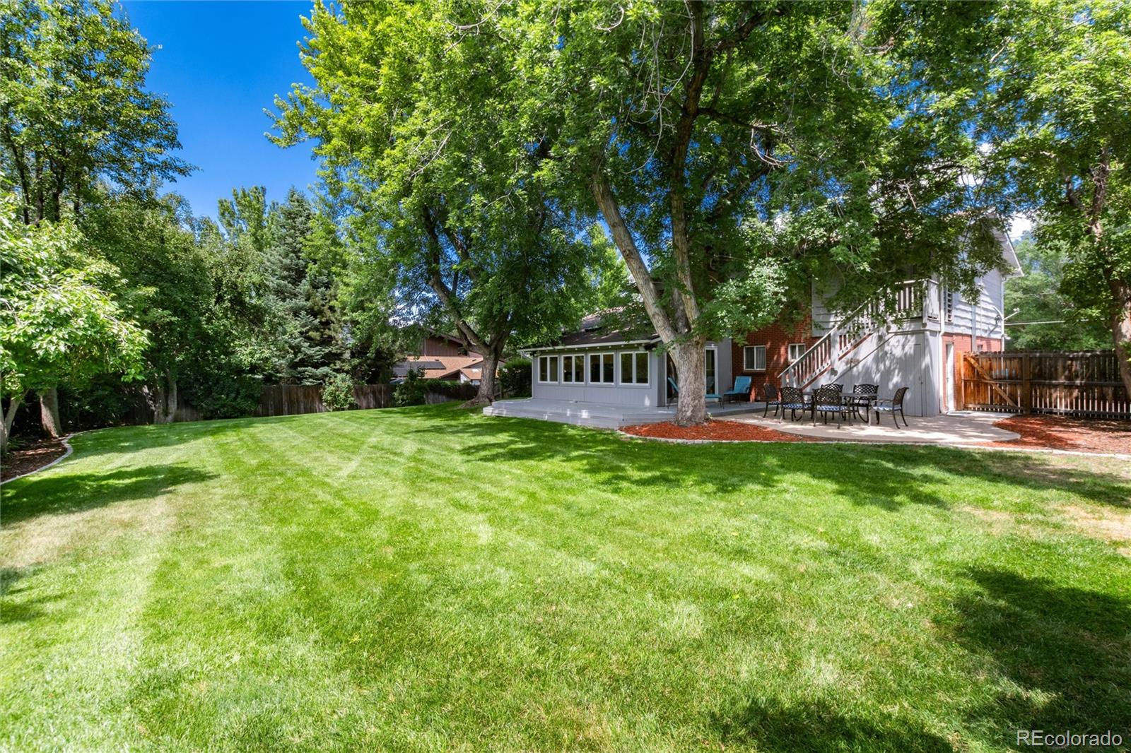 3375 Nelson Street Wheat Ridge, CO 80033 - Photo 30 of 35 a view of a house with backyard and sitting area