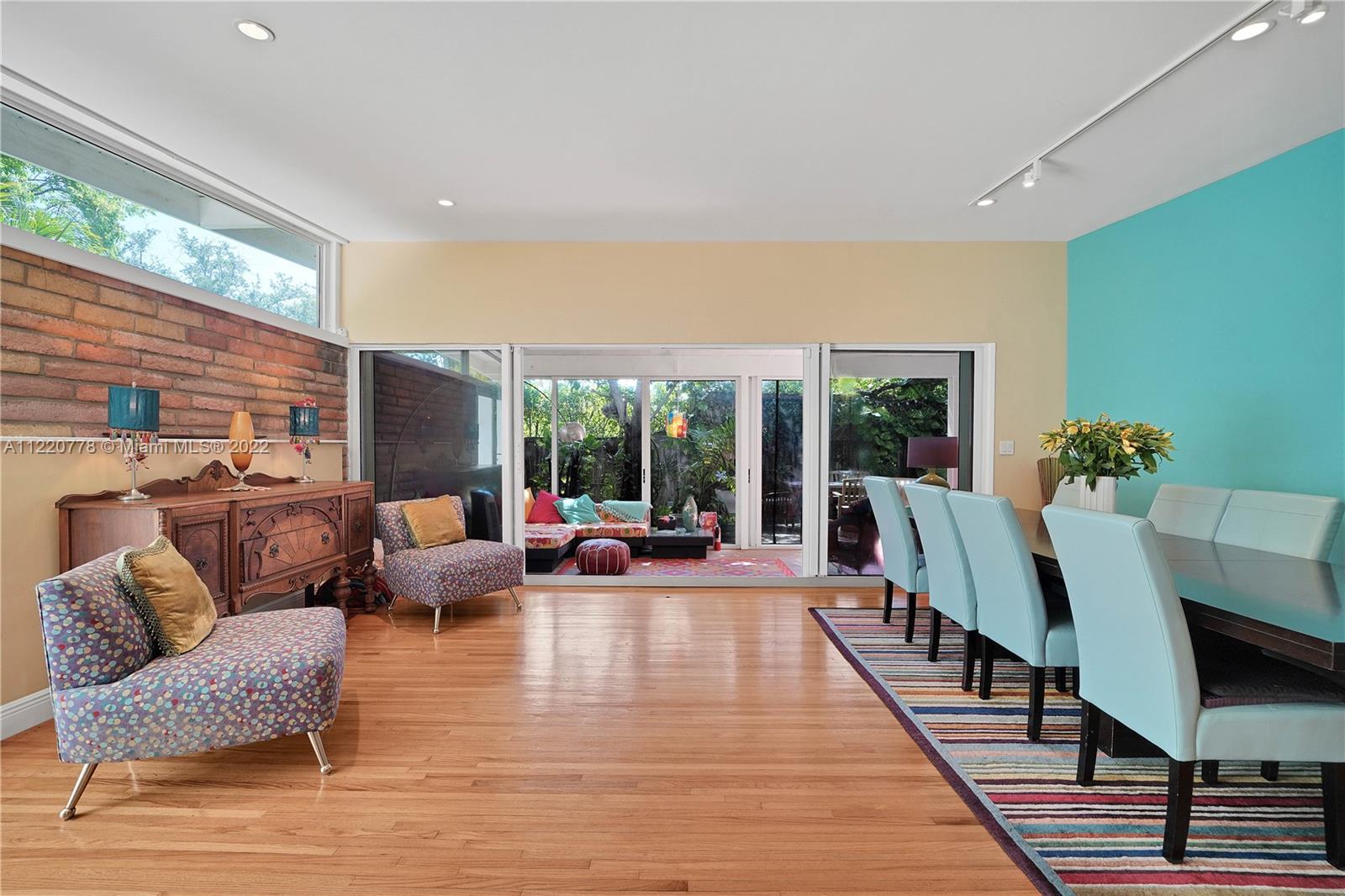 1810 Alamanda Drive North Miami, FL 33181 - Photo 11 of 40 a living room with furniture and a large window
