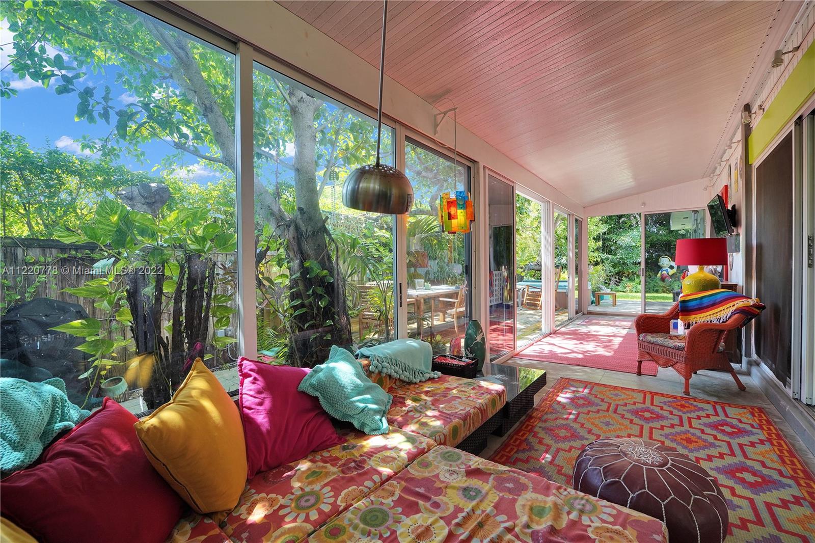 1810 Alamanda Drive North Miami, FL 33181 - Photo 18 of 40 a outdoor living space with furniture and garden view