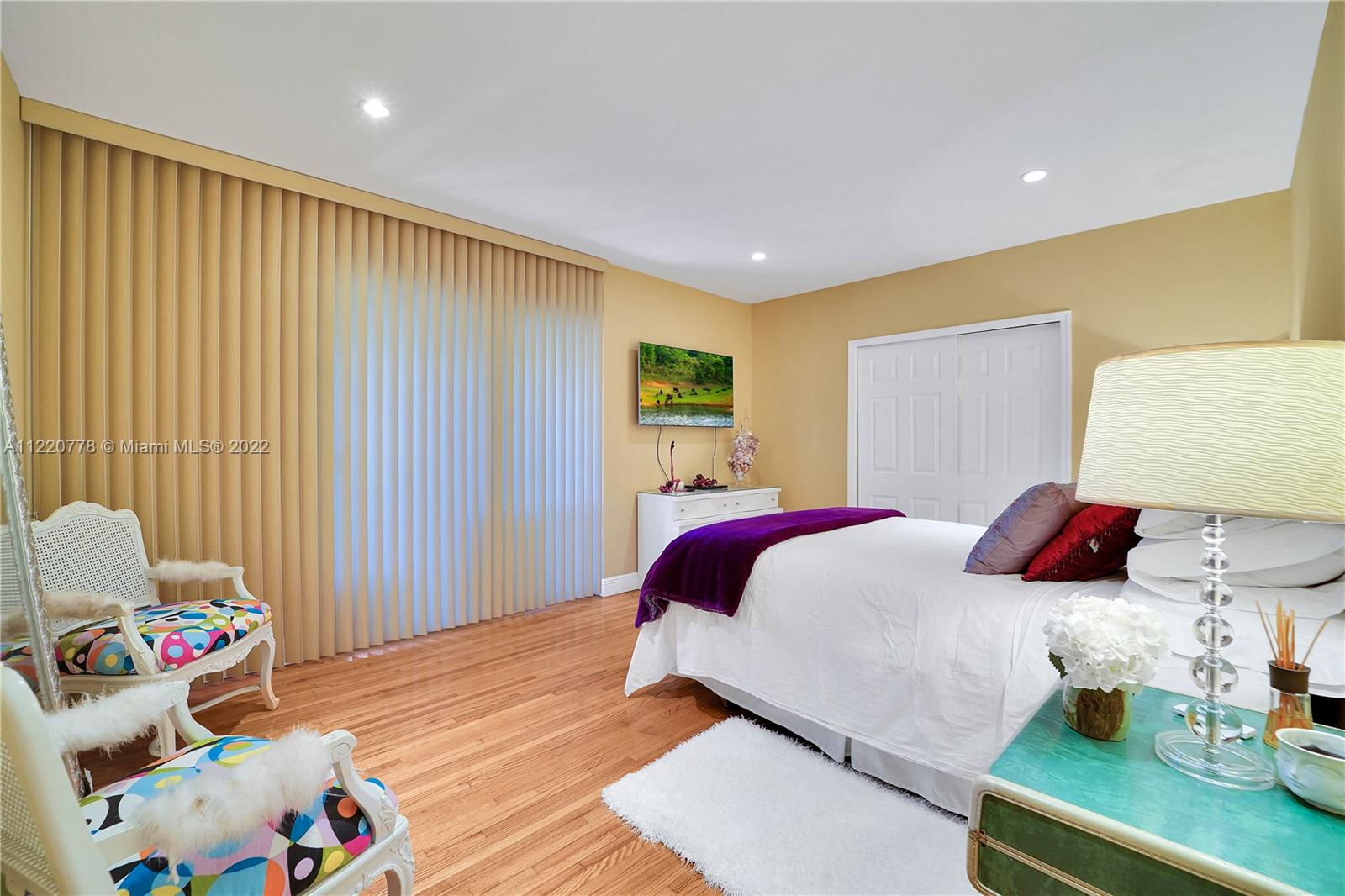 1810 Alamanda Drive North Miami, FL 33181 - Photo 21 of 40 a bedroom with a bed and a window