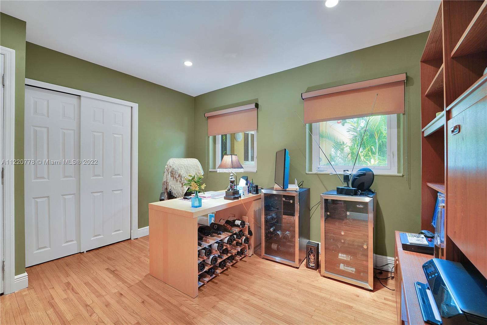 1810 Alamanda Drive North Miami, FL 33181 - Photo 24 of 40 a bed room with furniture and a window