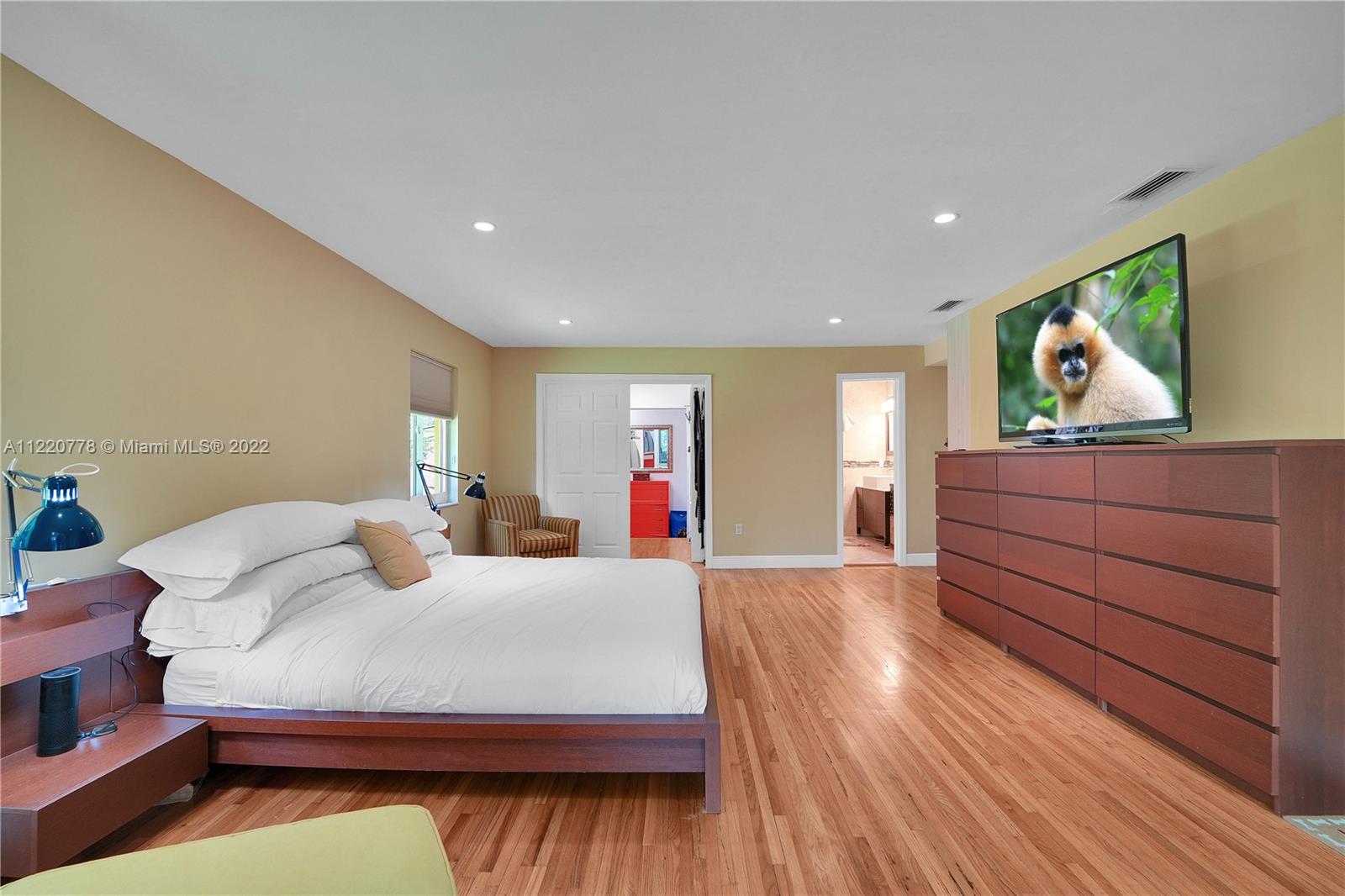 1810 Alamanda Drive North Miami, FL 33181 - Photo 25 of 40 a living room with furniture and a flat screen tv