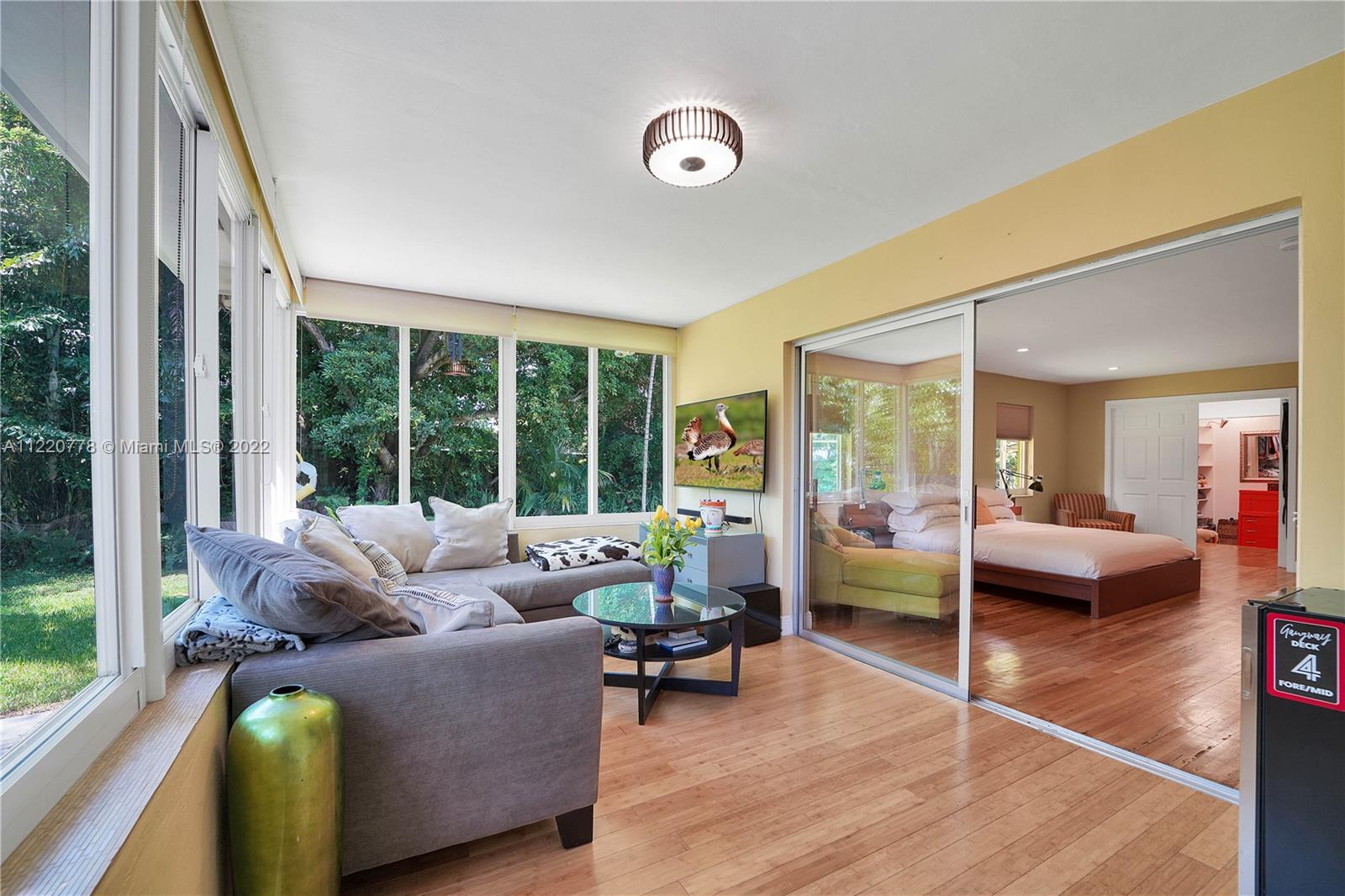 1810 Alamanda Drive North Miami, FL 33181 - Photo 32 of 40 a living room with furniture and a large window