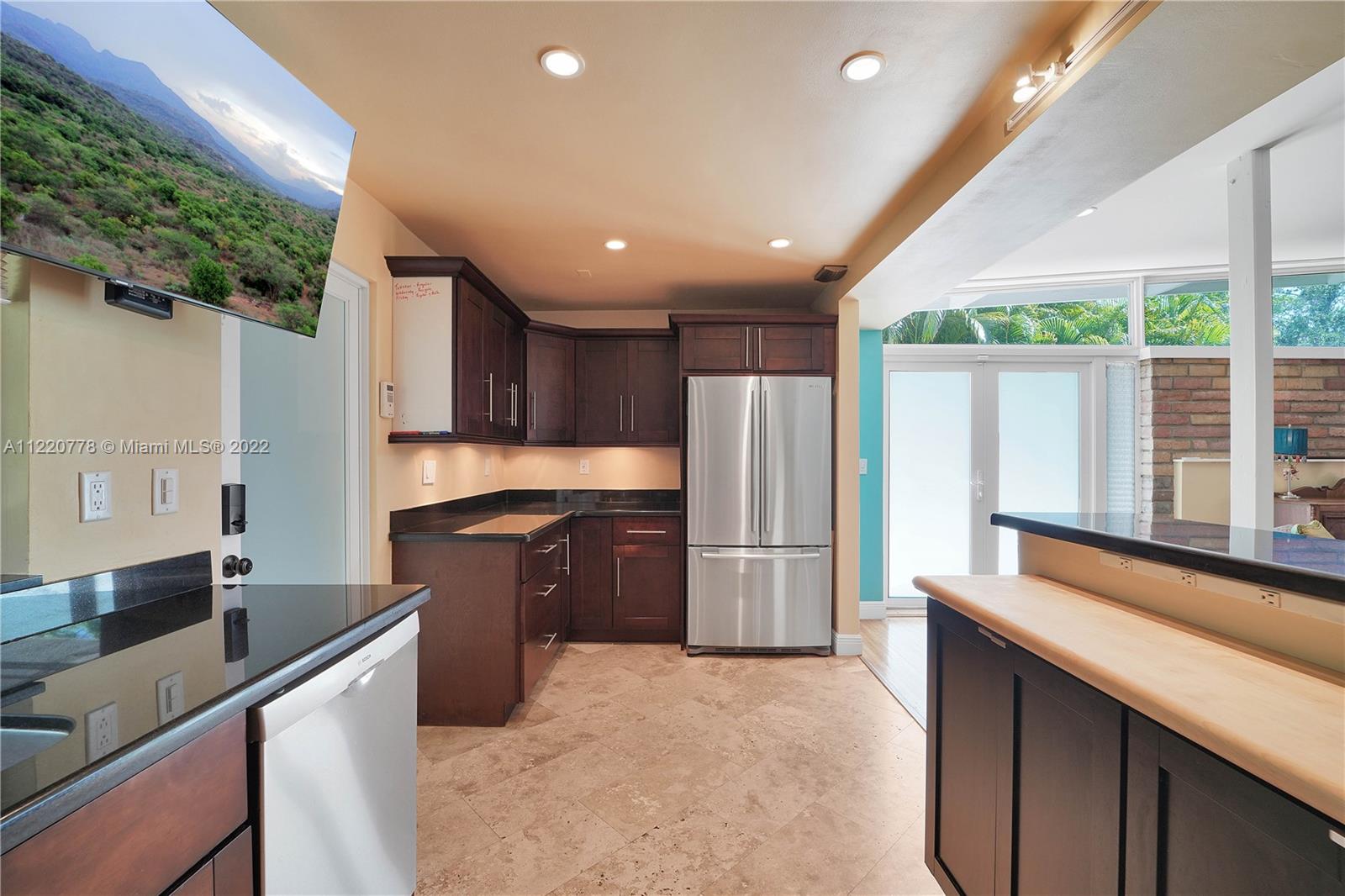 1810 Alamanda Drive North Miami, FL 33181 - Photo 7 of 40 a kitchen with a refrigerator and a sink