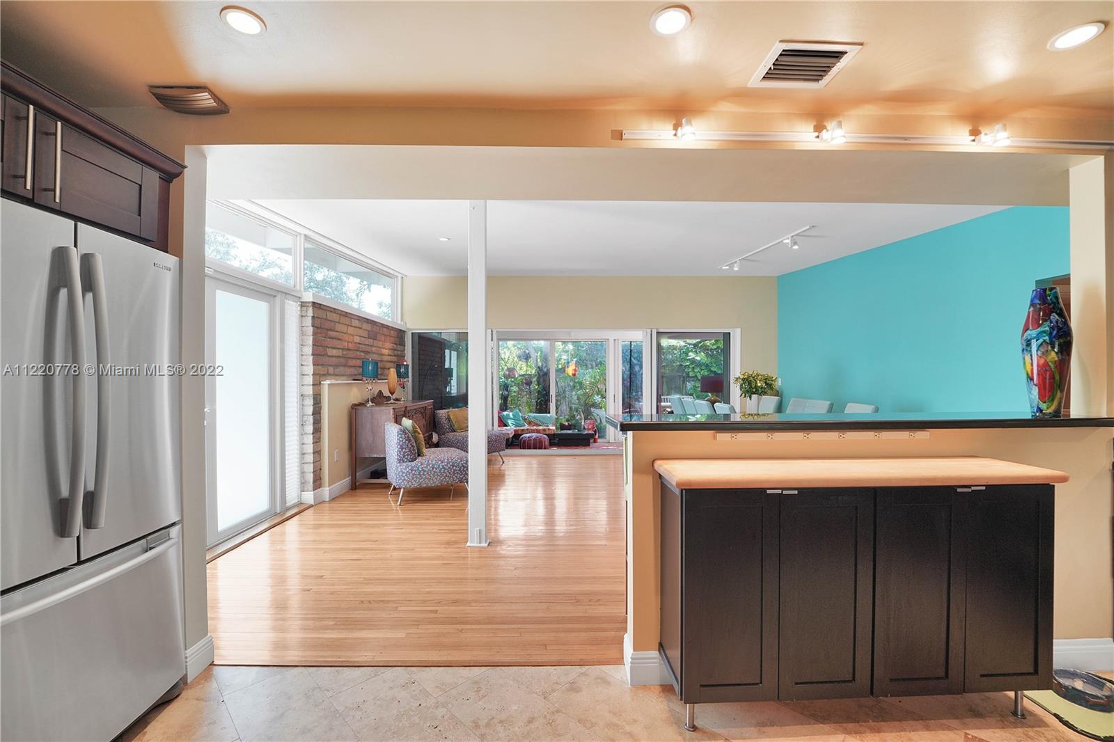 1810 Alamanda Drive North Miami, FL 33181 - Photo 8 of 40 a living room with fireplace furniture and a large window