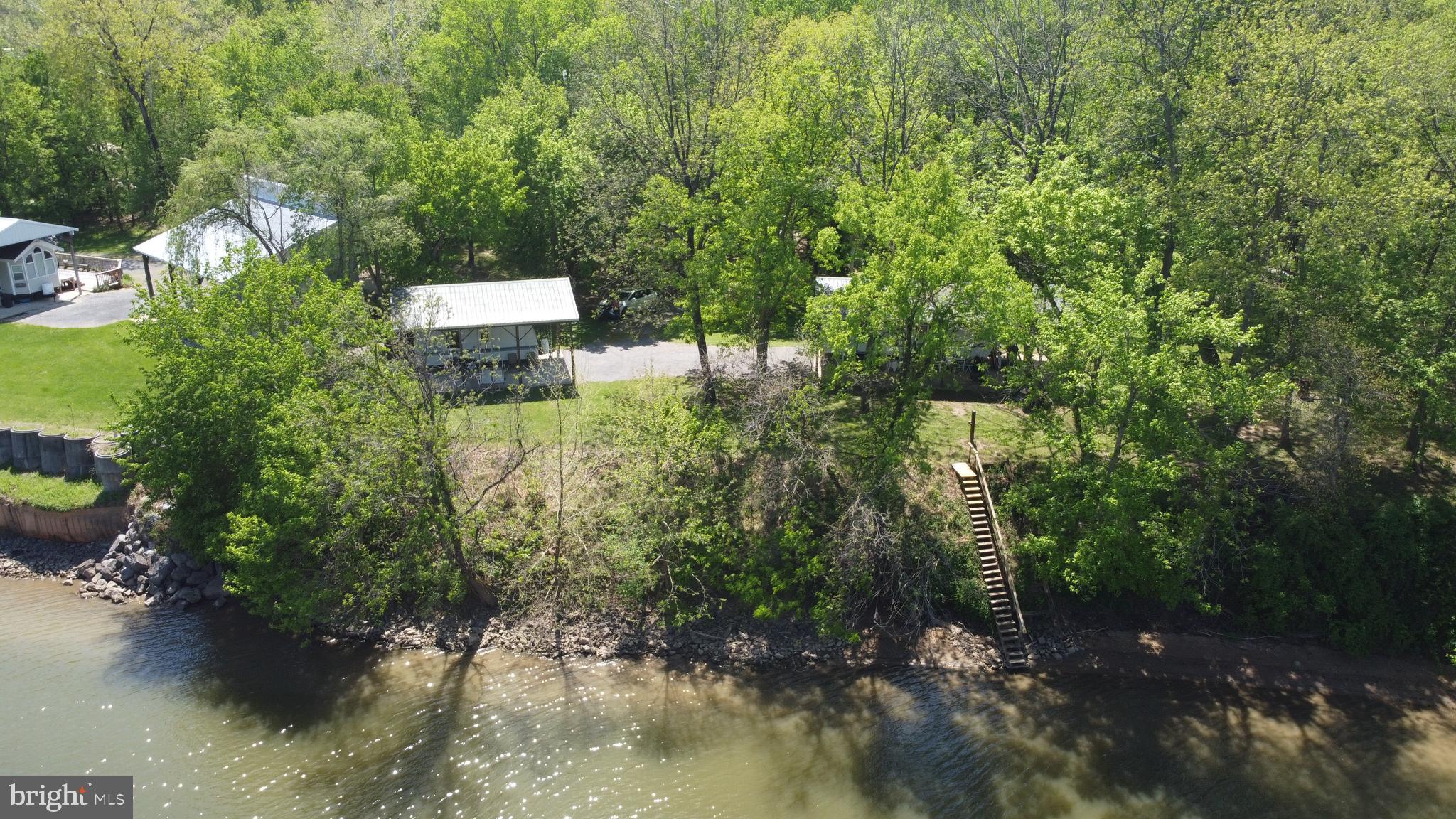 3480 Whitings Neck Road Martinsburg, WV 25404 - Photo 25 of 36 a view of a forest with a lake