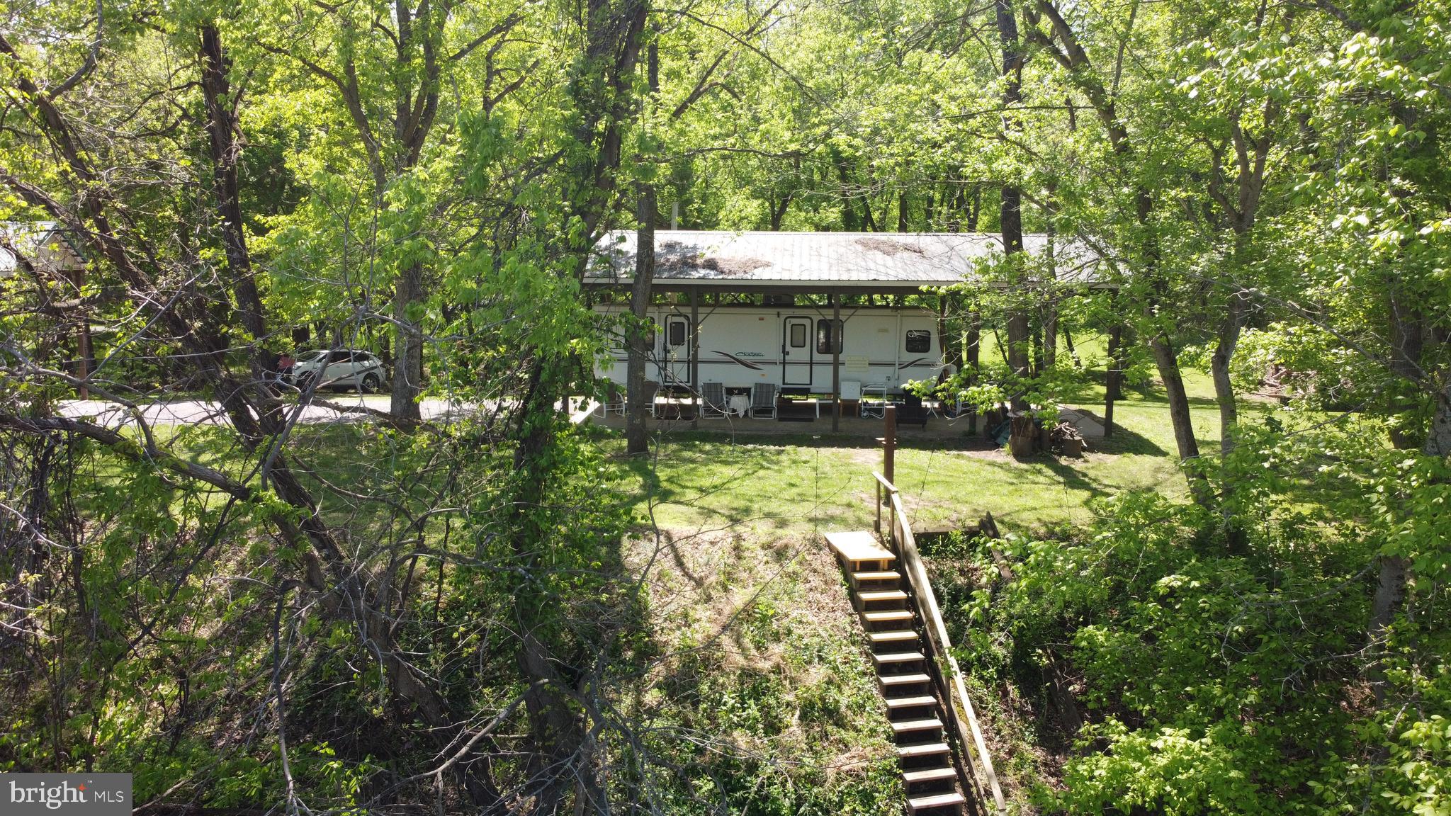 3480 Whitings Neck Road Martinsburg, WV 25404 - Photo 28 of 36 a backyard of a house with table and chairs
