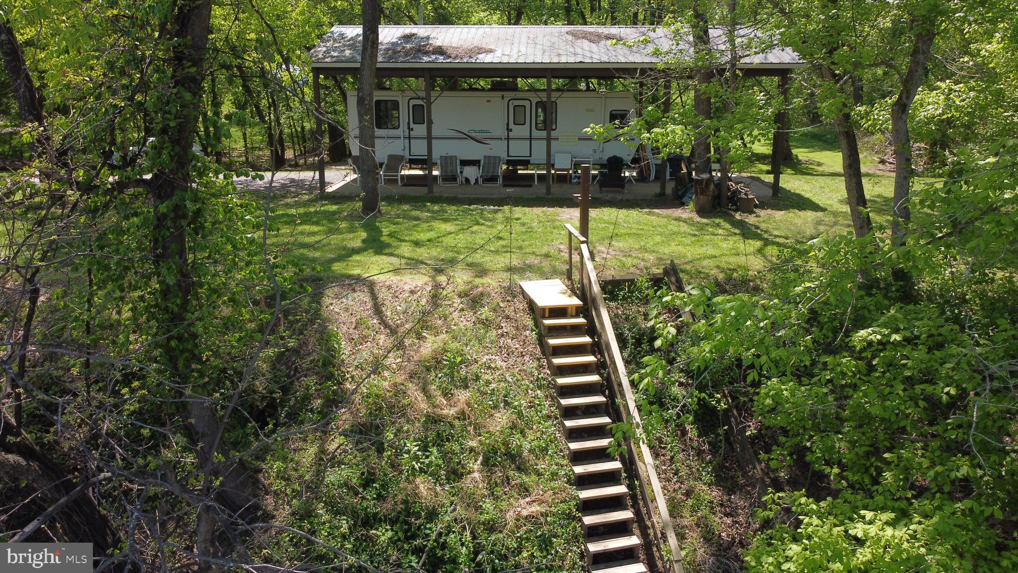 3480 Whitings Neck Road Martinsburg, WV 25404 - Photo 29 of 36 a view of a backyard with sitting area and garden
