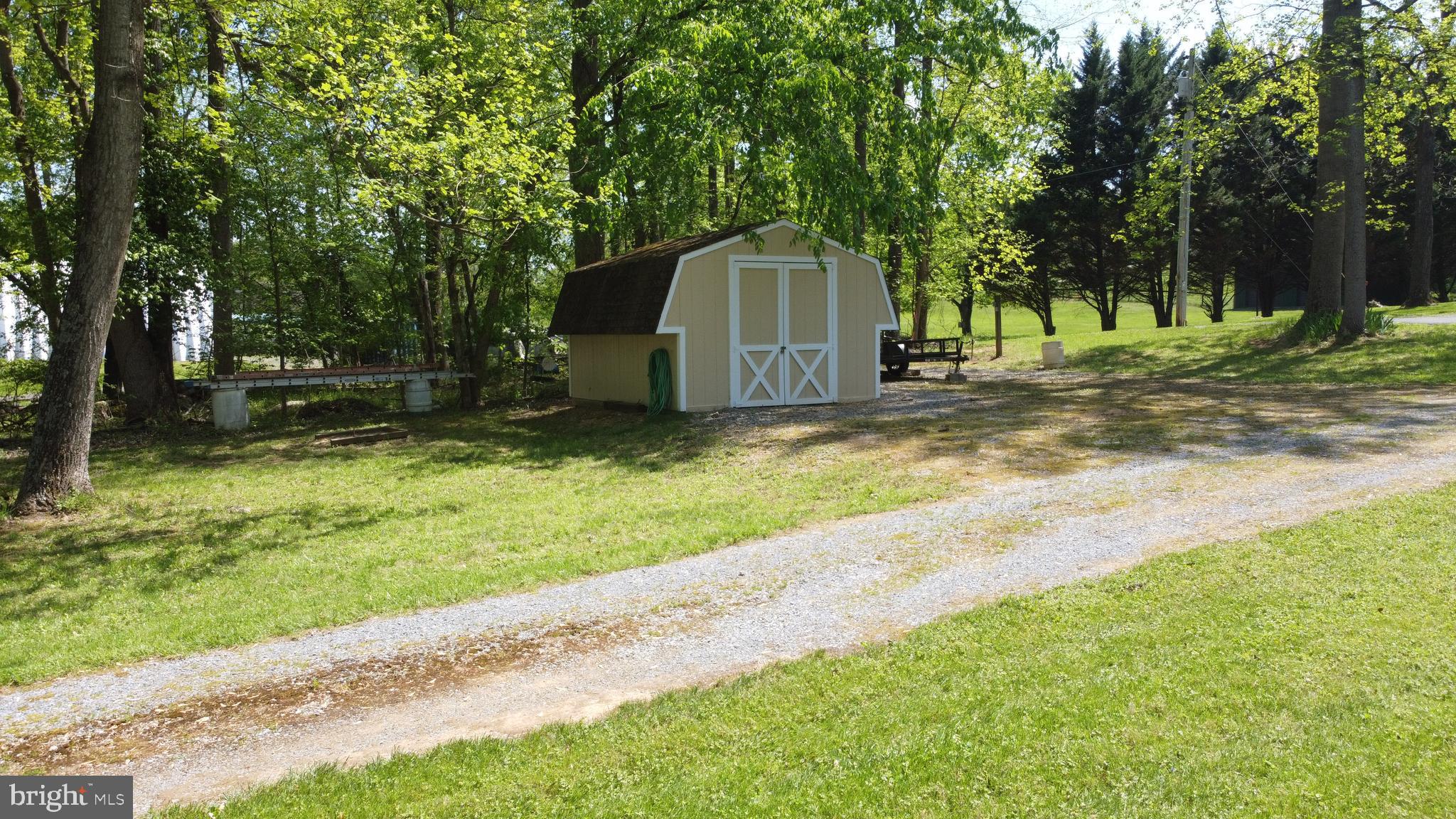 3480 Whitings Neck Road Martinsburg, WV 25404 - Photo 32 of 36 a view of a yard with a house and large trees