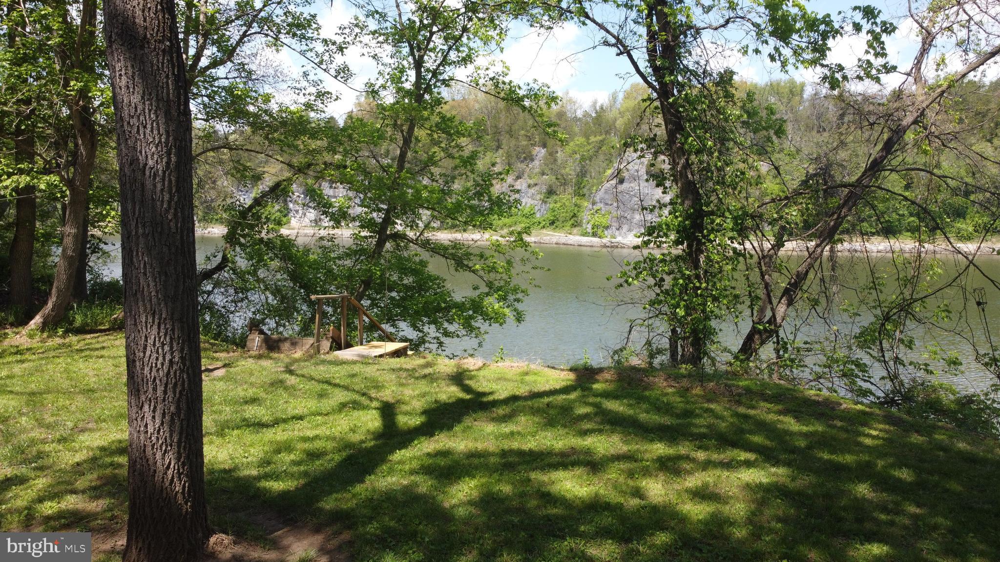 3480 Whitings Neck Road Martinsburg, WV 25404 - Photo 7 of 36 a view of a lake from a yard