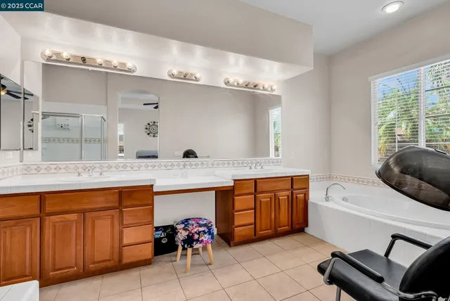 a view of walk in closet with clothes