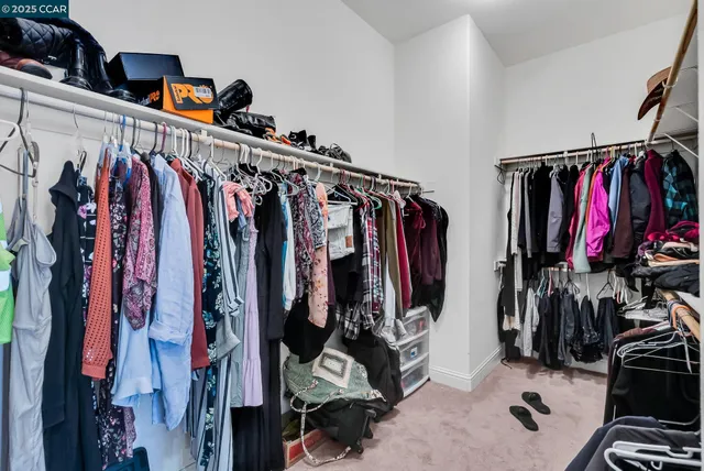 a bedroom with a bed and couch