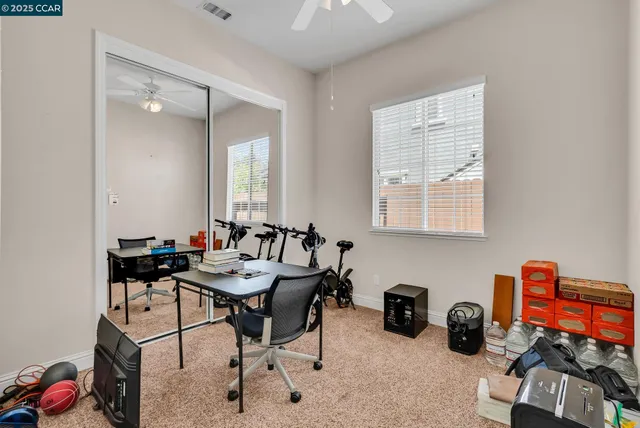 a view of a table and chairs under an umbrella in patio