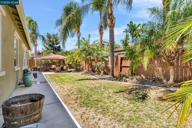 a outdoor living space with patio furniture and garden view