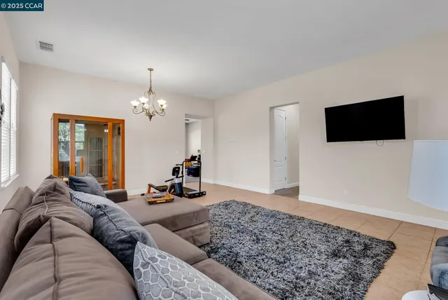a living room with furniture fireplace and a flat screen tv