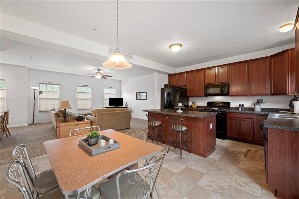 141 Rylie Drive Harmony, PA 16037 - Photo 12 of 31 Whether eating or working you have full view of the family room.