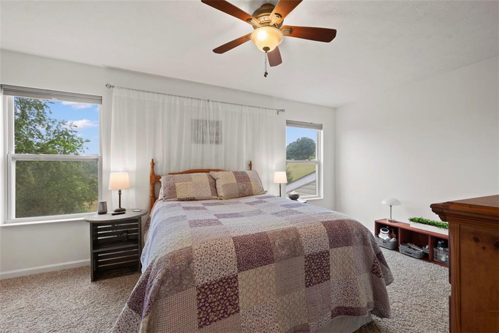 141 Rylie Drive Harmony, PA 16037 - Photo 16 of 31 Step upstairs and find the large master bedroom that is flanked with 2 windows for natural light.